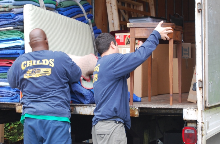men loading truck